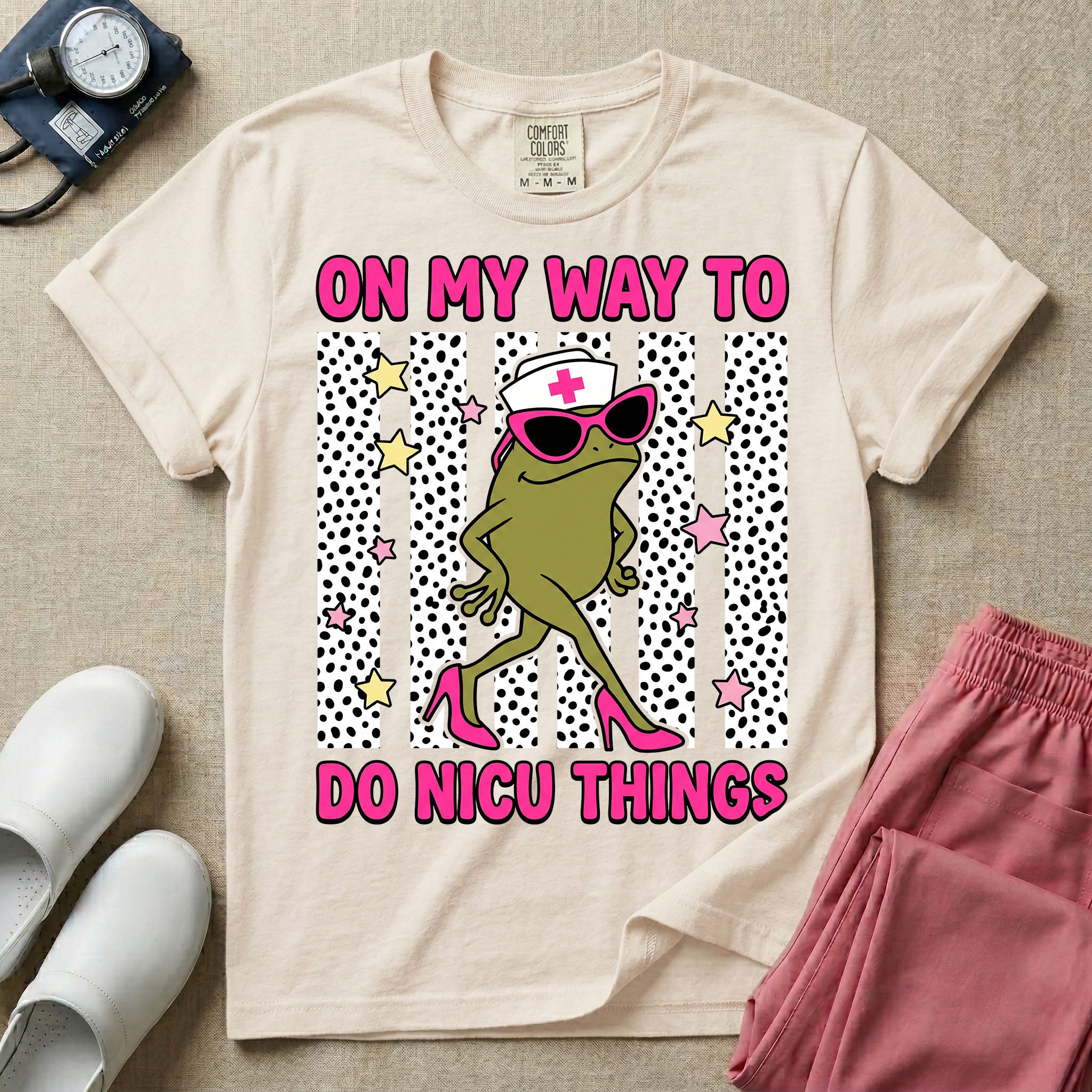 Funny NICU nurse design featuring the text On My Way To Do NICU Things with a sassy frog wearing high heels, sunglasses, and a nurse cap strutting across spotted vertical stripes and stars.