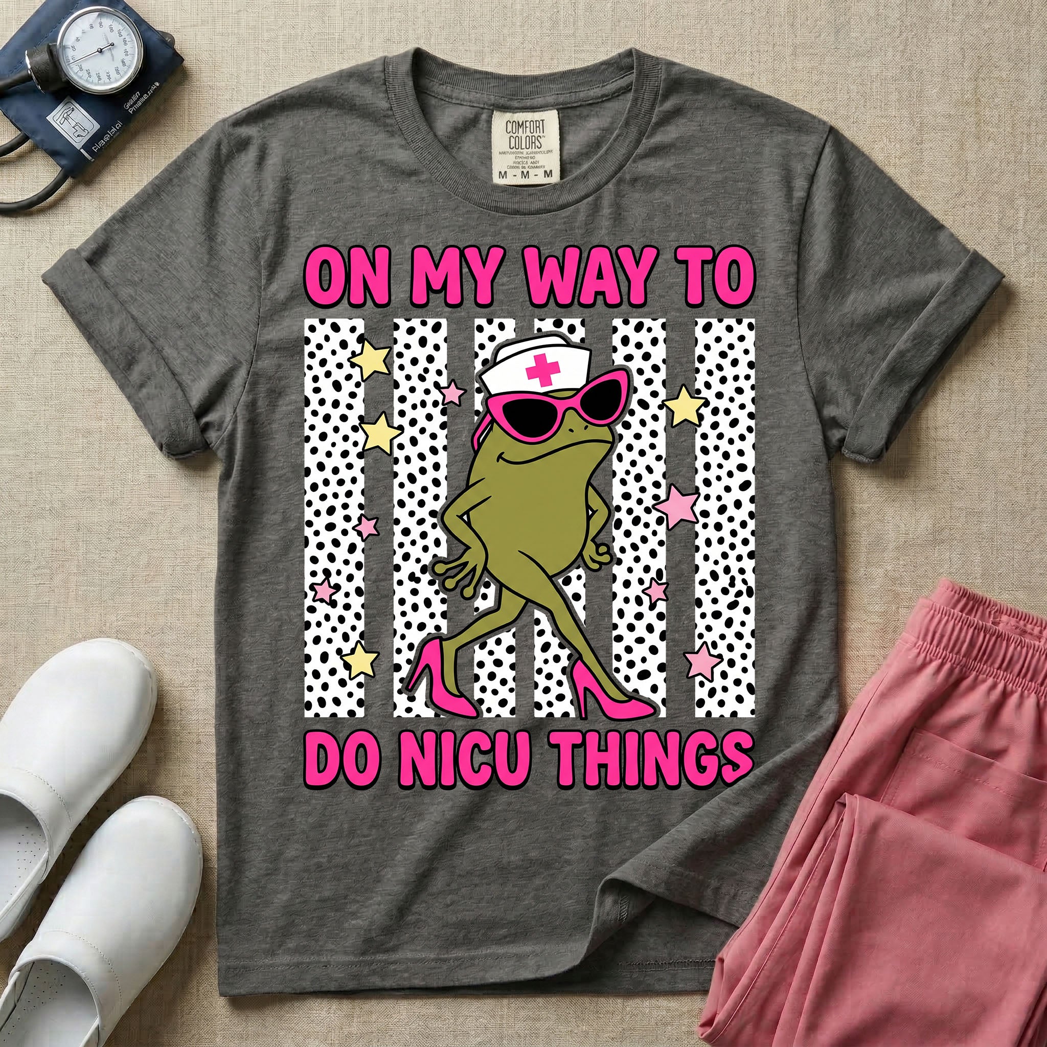 Funny NICU nurse design featuring the text On My Way To Do NICU Things with a sassy frog wearing high heels, sunglasses, and a nurse cap strutting across spotted vertical stripes and stars.