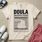 Funny doula design featuring bold text reading Doula above a novelty nutrition facts label listing humorous daily values for hard working, multitasking, passion, caring, zero sleep, and caffeine.
