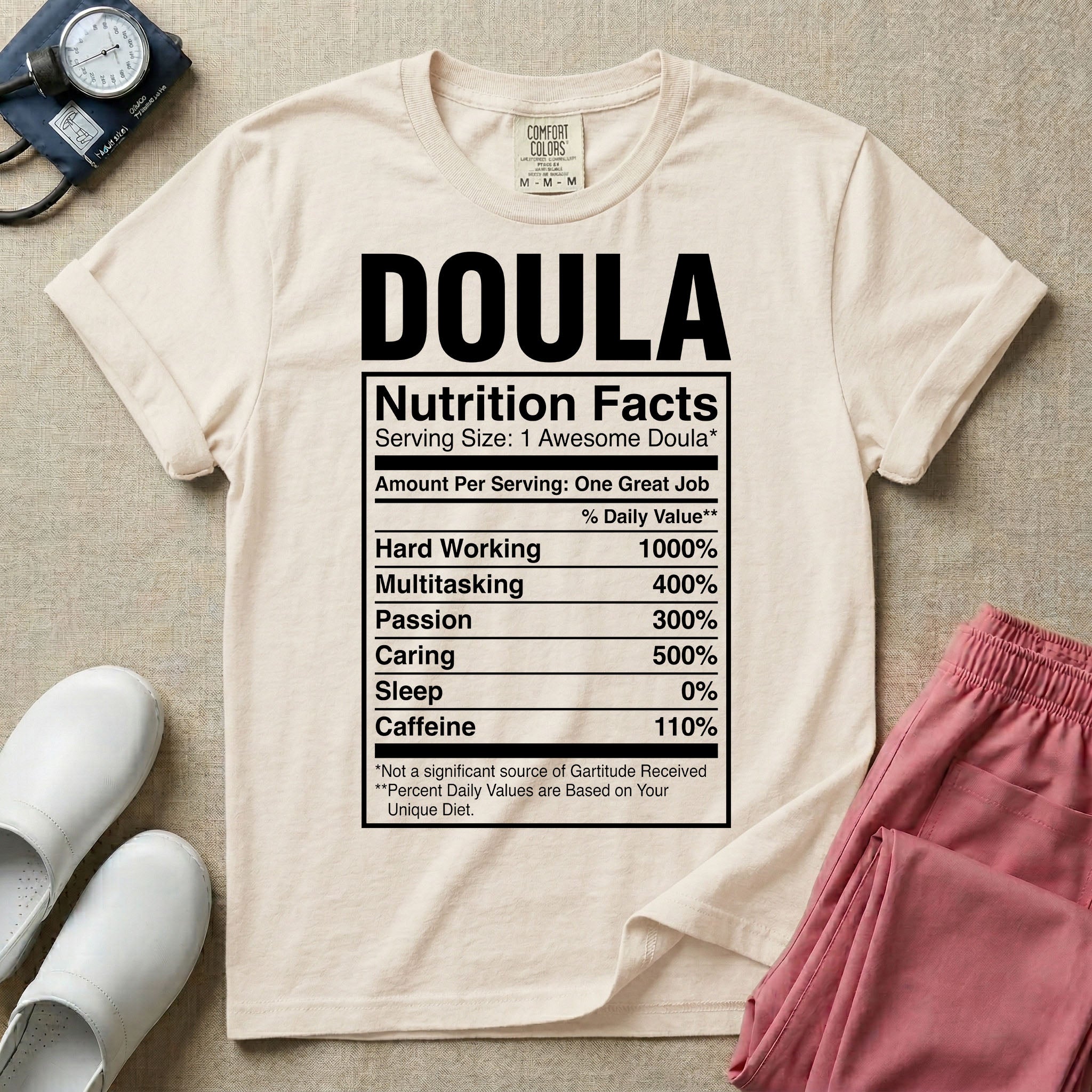 Funny doula design featuring bold text reading Doula above a novelty nutrition facts label listing humorous daily values for hard working, multitasking, passion, caring, zero sleep, and caffeine.