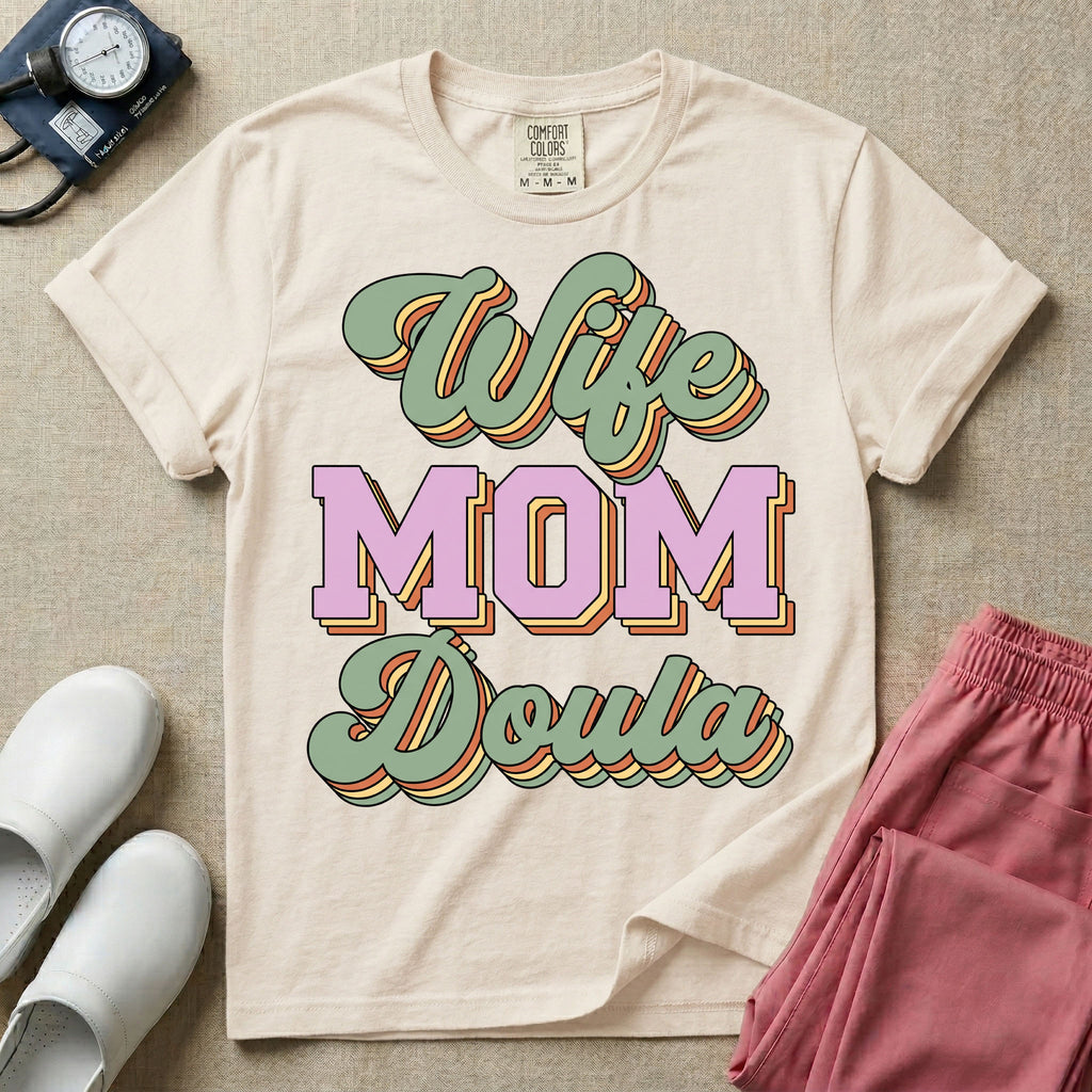 Retro birth worker design featuring stacked layered 3D lettering spelling Wife Mom Doula with vintage cursive script and collegiate block typography.