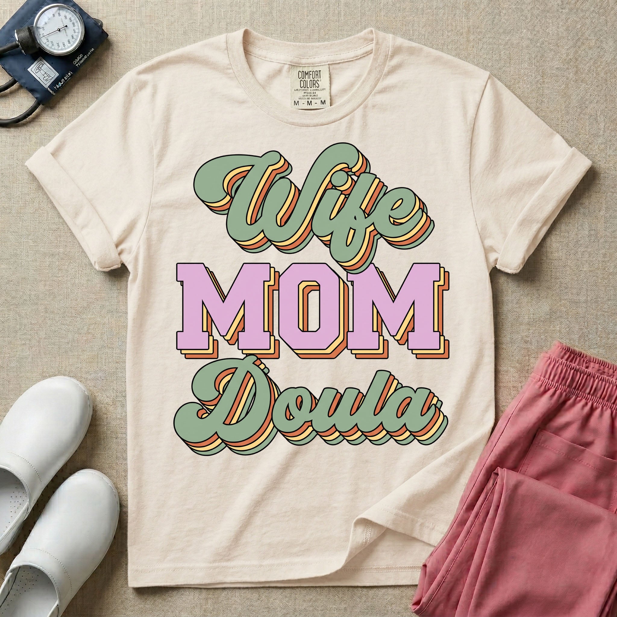 Retro birth worker design featuring stacked layered 3D lettering spelling Wife Mom Doula with vintage cursive script and collegiate block typography.
