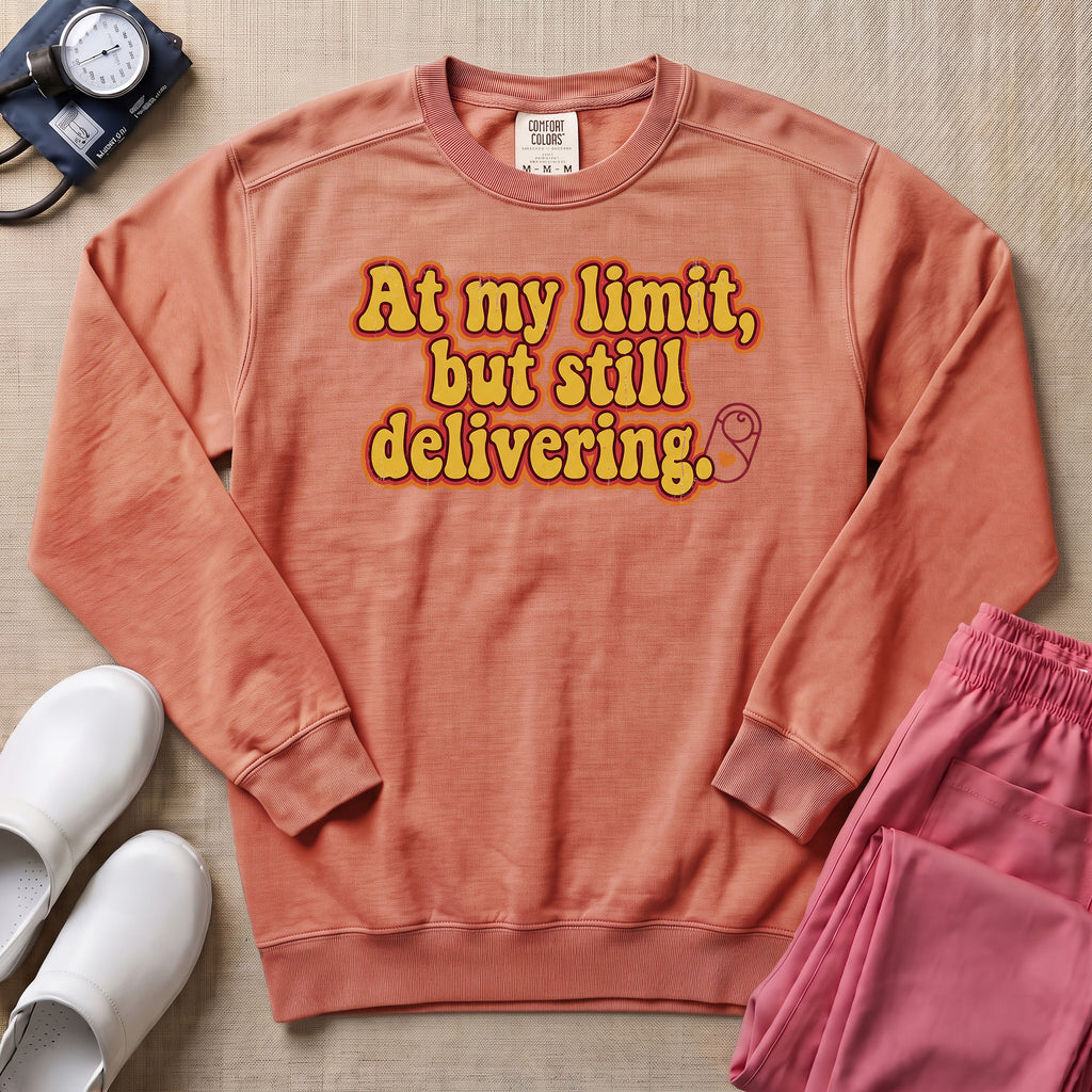 Funny L&D Nurse At My Limit But Still Delivering Retro Sweatshirt - Terracotta Comfort Colors Sweatshirt | HugTee