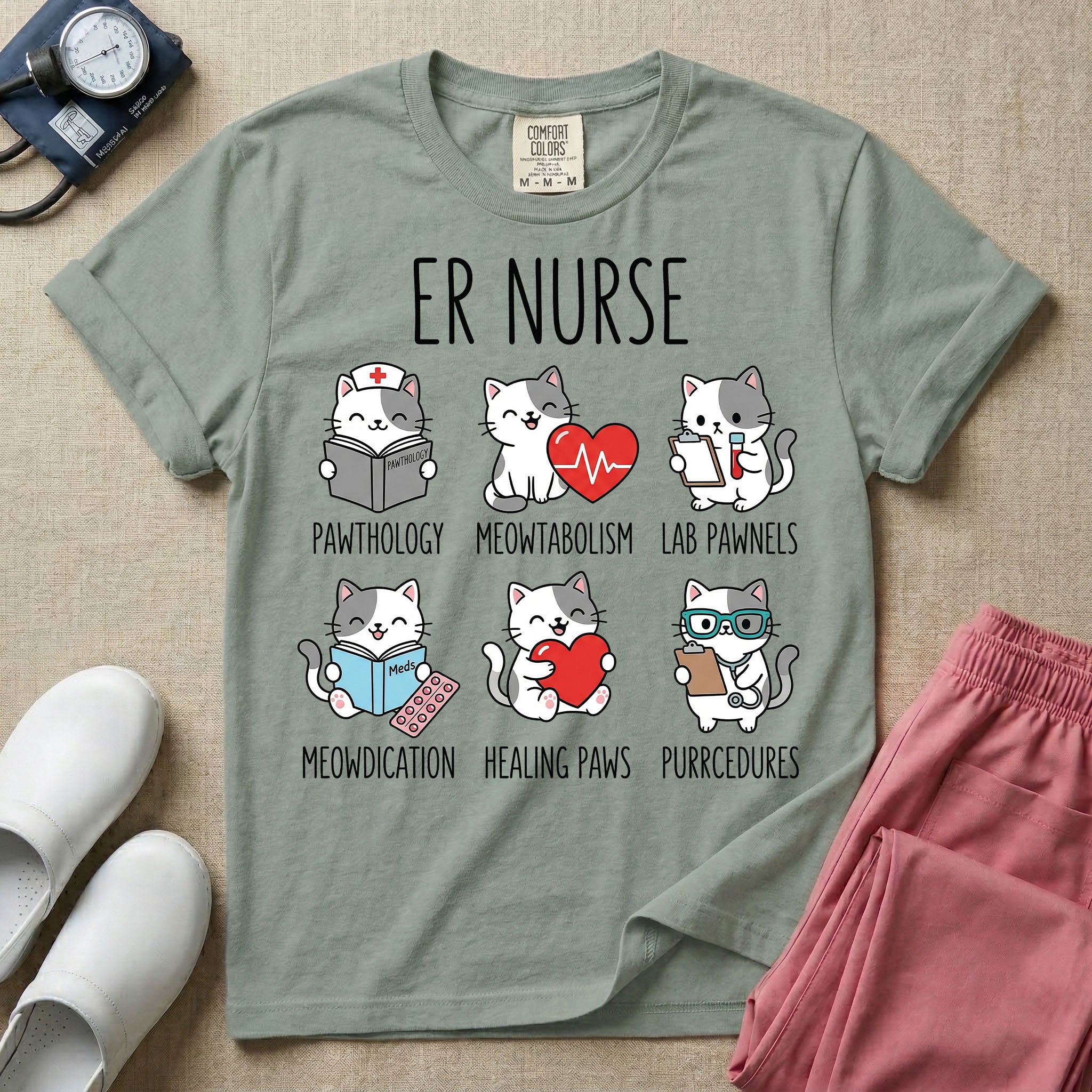 A funny t-shirt for emergency room nurses featuring the text "ER NURSE" above a grid of six cute cartoon cats demonstrating medical puns, including a cat reading for "PAWTHOLOGY", a cat with an ECG heart for "MEOWTABOLISM", a cat holding a test tube for "LAB PAWNELS", a cat with pills for "MEOWDICATION", a cat holding a heart for "HEALING PAWS", and a cat with a stethoscope for "PURRCEDURES".