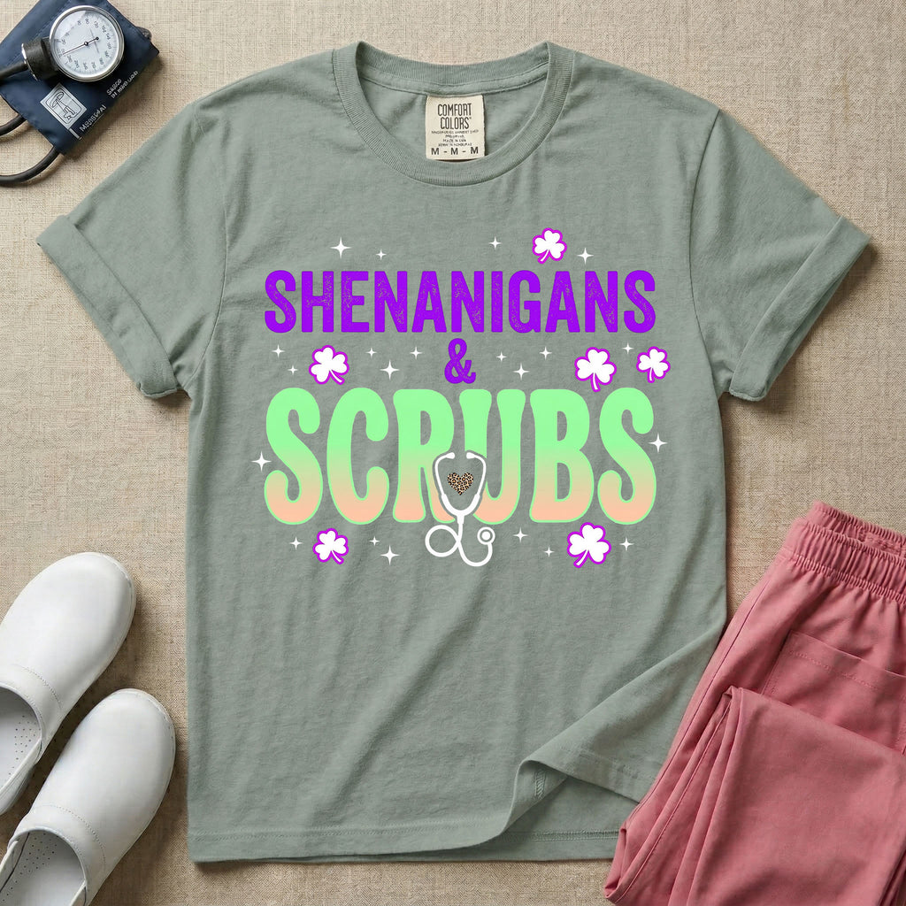 General nursing St. Patrick's Day t-shirt featuring a retro wavy font with the text "SHENANIGANS & SCRUBS" surrounded by shamrock graphics and a stethoscope.
