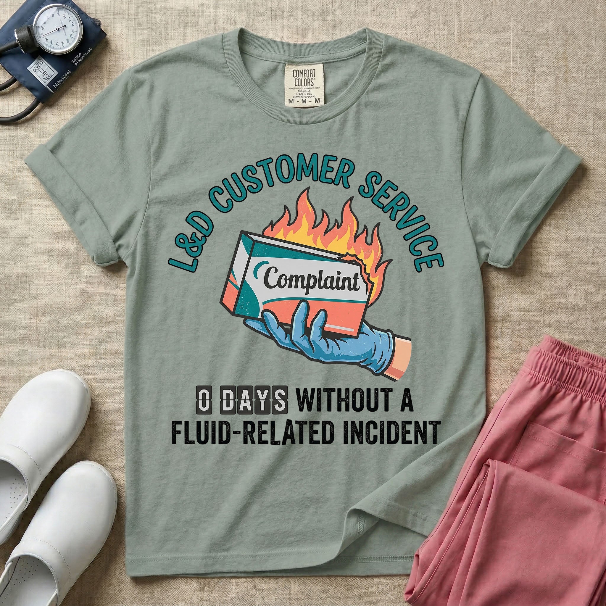 Labor and Delivery L&D nurse t-shirt with funny customer service burning complaint box and zero days without a fluid-related incident graphic in bay color.