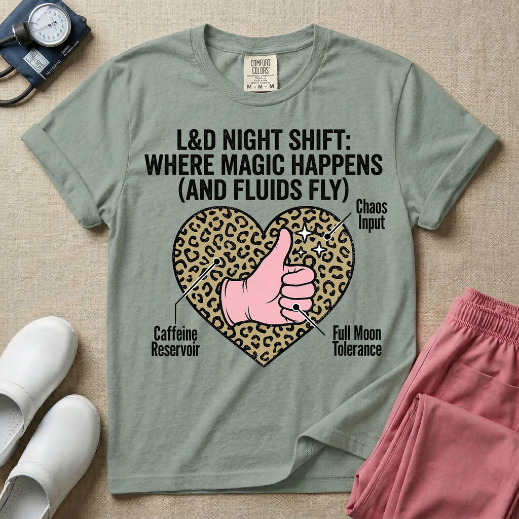 Labor and Delivery L&D nursing t-shirt featuring a leopard print heart diagram with a gloved thumbs-up and the text "L&D NIGHT SHIFT: WHERE MAGIC HAPPENS (AND FLUIDS FLY)"