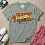 A t-shirt featuring the stacked text PACIFIERS PUMPKINS & PREEMIES in wavy orange, yellow, and brown retro lettering decorated with a pumpkin, pacifier, and baby footprints, with Neonatal Intensive Care Unit written in cursive below.