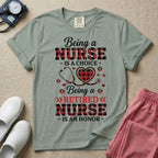 A t-shirt featuring the text Being a NURSE IS A CHOICE Being a RETIRED NURSE IS AN HONOR surrounding a central graphic of a red and black buffalo plaid heart intertwined with a stethoscope.