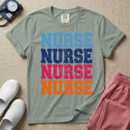 A t-shirt featuring the word NURSE repeated four times in a stacked vertical layout with a distressed, vintage texture in blue, navy, pink, and orange colors.