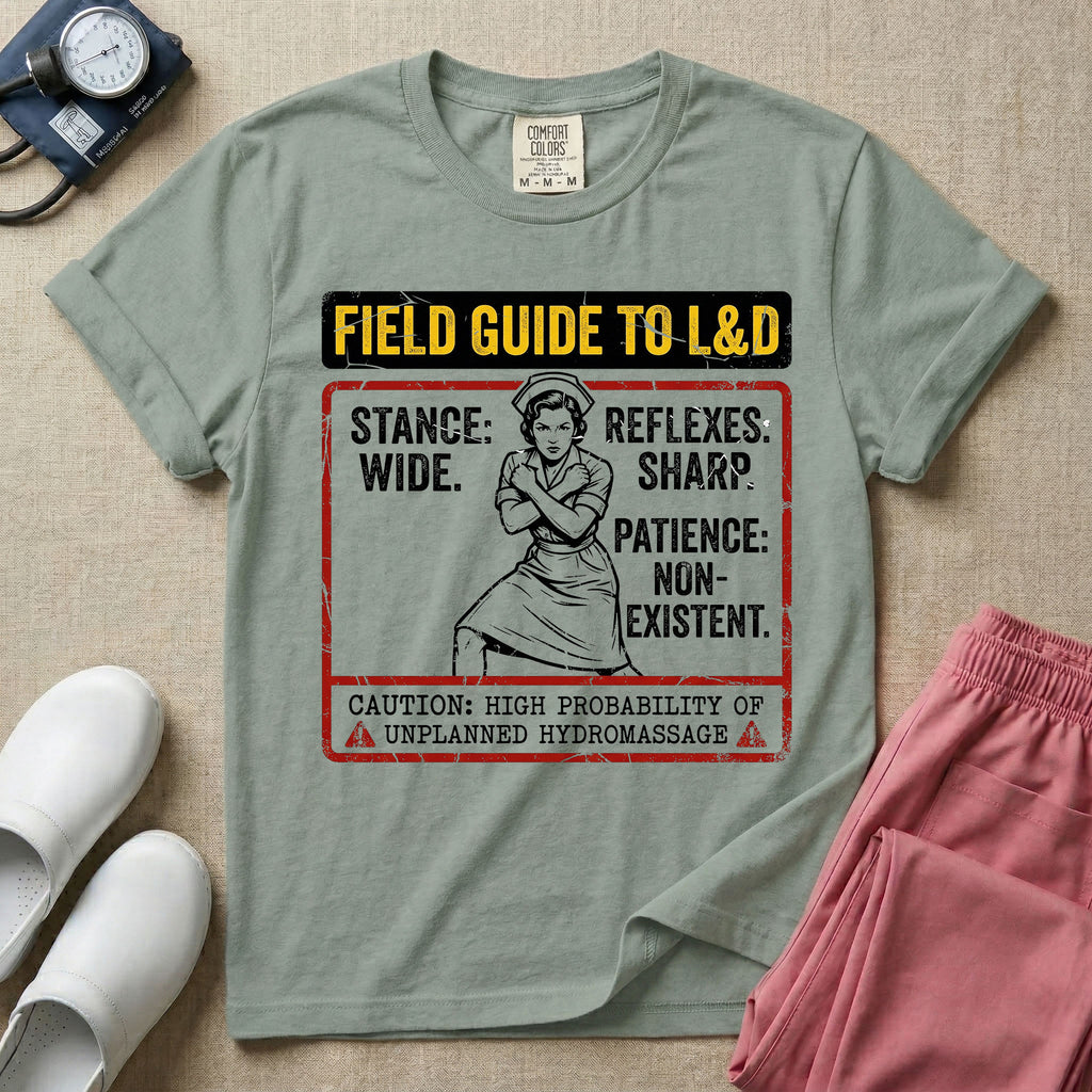A humorous and retro graphic tee for labor and delivery nurses featuring a vintage nurse illustration alongside the text "FIELD GUIDE TO L&D", "STANCE: WIDE", "REFLEXES: SHARP", "PATIENCE: NON-EXISTENT", and "CAUTION: HIGH PROBABILITY OF UNPLANNED HYDROMASSAGE".