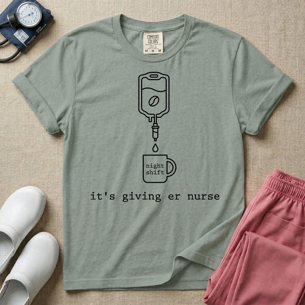 A funny minimalist ER nursing t-shirt featuring a white line drawing of an IV bag containing a coffee bean dripping into a mug labeled "night shift", sitting above the lower-case typewriter text "it's giving er nurse".