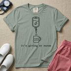 A funny minimalist ER nursing t-shirt featuring a white line drawing of an IV bag containing a coffee bean dripping into a mug labeled "night shift", sitting above the lower-case typewriter text "it's giving er nurse".