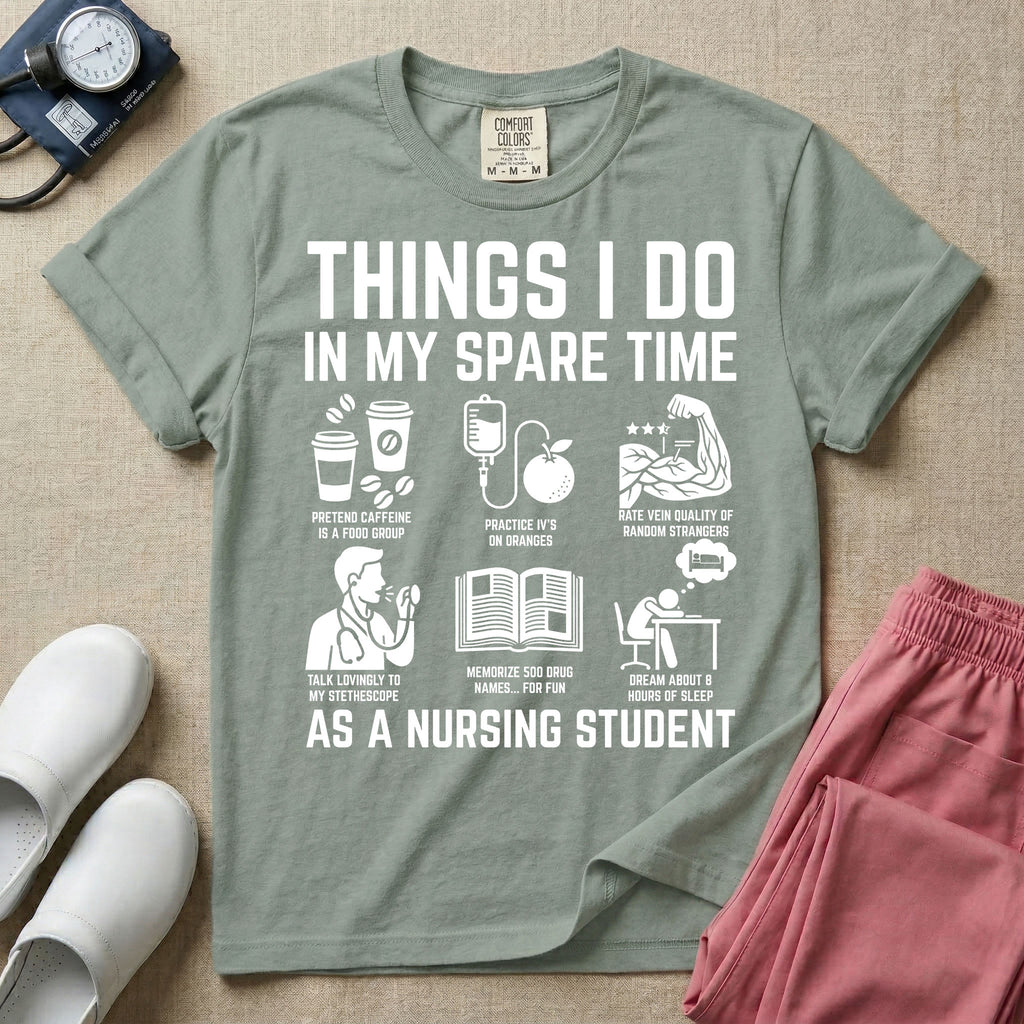 A t-shirt featuring the text THINGS I DO IN MY SPARE TIME AS A NURSING STUDENT surrounded by humorous line-art icons depicting studying, drinking coffee, and lacking sleep.