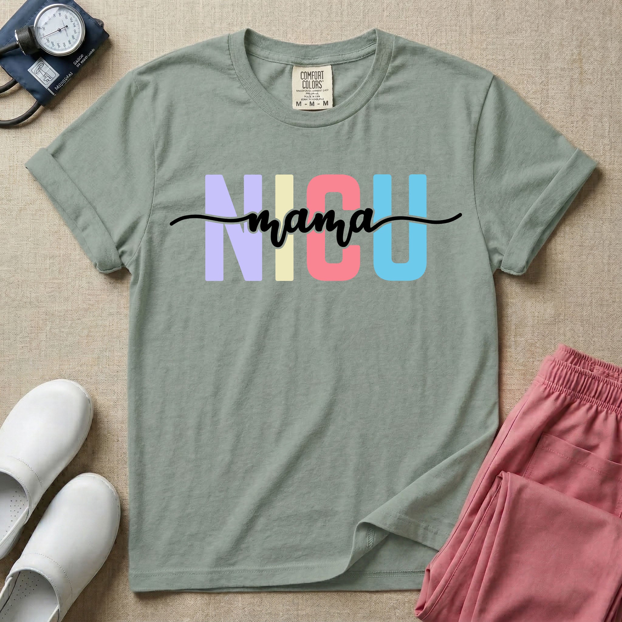 A graphic for the Neonatal Intensive Care Unit featuring the word 'NICU' in large, colorful pastel block letters with the word 'mama' written in a flowing white cursive font across the center.