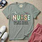 A humorous General Nursing graphic featuring the word NURSE in large, playfully patterned letters including plaid, leopard print, and floral designs, accented by a sleeping crescent moon and a syringe, positioned above text that reads Night Shift: Vibrating on Caffeine and Chaos.