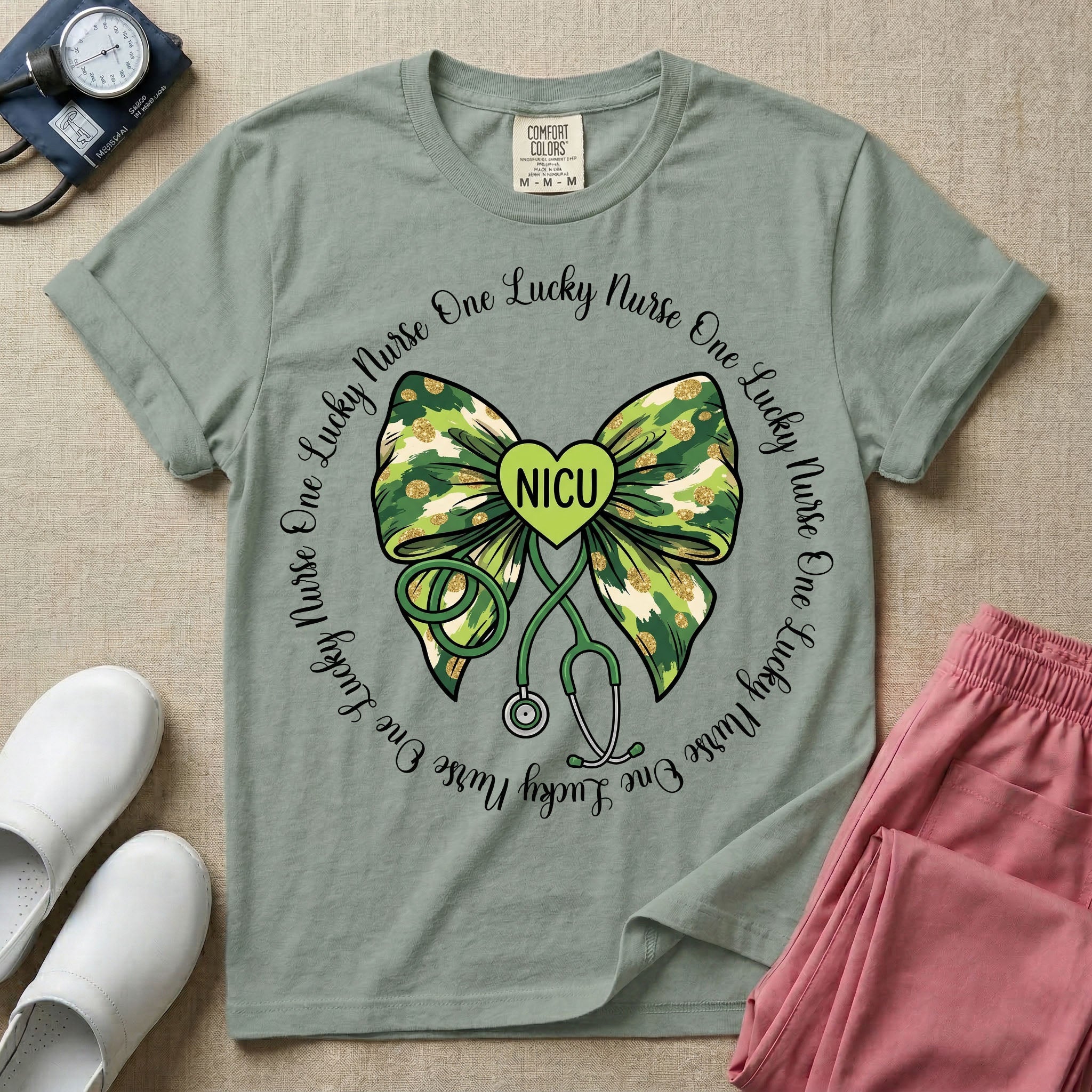 A graphic for a Neonatal Intensive Care Unit featuring a green camouflage bow with a stethoscope dangling from the bottom, a green heart in the center reading 'NICU', and the phrase 'One Lucky Nurse' repeating in a circle around the design.