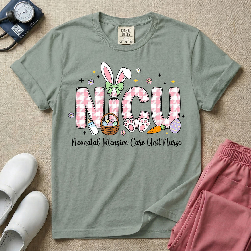Neonatal Intensive Care Unit NICU nursing t-shirt featuring the letters NICU in a pink plaid pattern with bunny ears on the I, alongside a basket and Easter eggs, positioned above the cursive text "Neonatal Intensive Care Unit Nurse".