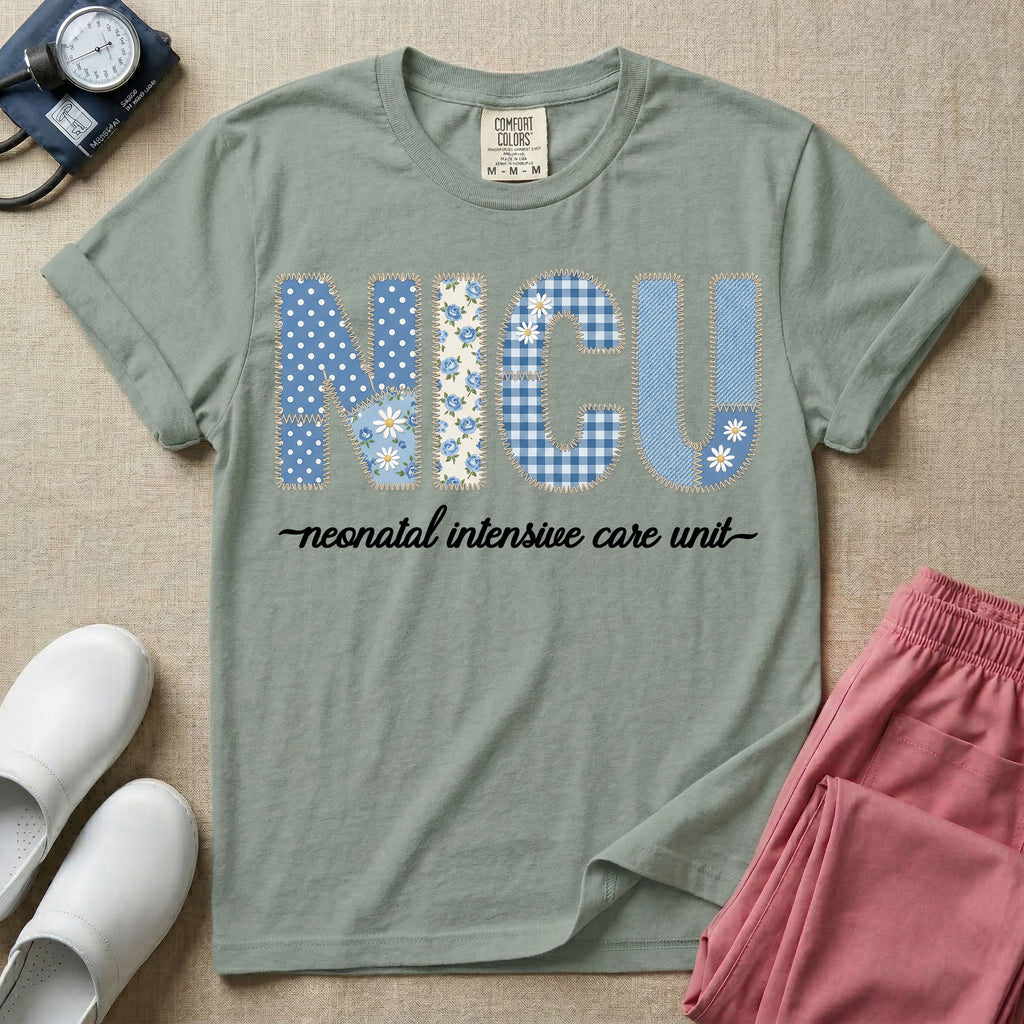 A t-shirt for NICU nurses featuring the large text "NICU" designed to look like faux embroidery with floral and plaid patterns, and the words "neonatal intensive care unit" written in a delicate script font underneath.