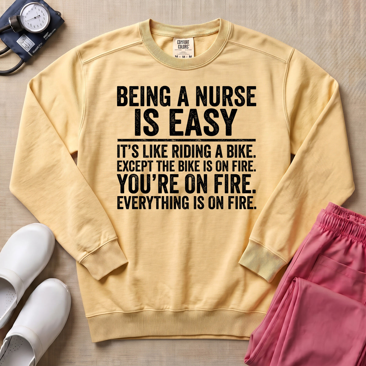 Funny Being A Nurse Is Easy Bike On Fire Sarcastic Nurse Sweatshirt - Butter Comfort Colors Sweatshirt | HugTee