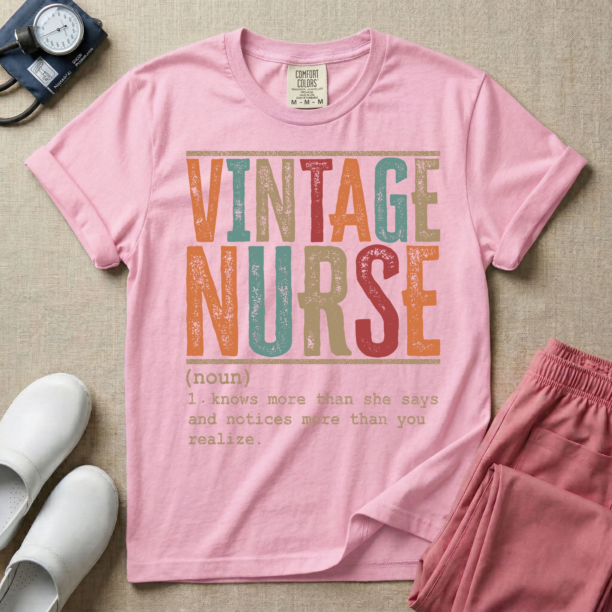 A humorous General Nursing graphic featuring large distressed retro-style block letters spelling VINTAGE NURSE, positioned above a dictionary-style definition in white typewriter font that reads (noun) 1. knows more than she says and notices more than you realize.