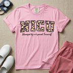Neonatal Intensive Care Unit NICU nurse t-shirt with leopard print block letters and funny managed by a 4-pound terrorist graphic in blossom color.
