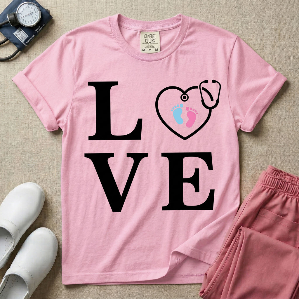 A minimalist nursing t-shirt featuring the word LOVE stacked in large white serif letters, with the letter O replaced by a white stethoscope shaped like a heart containing two small baby footprints, one pink and one blue.