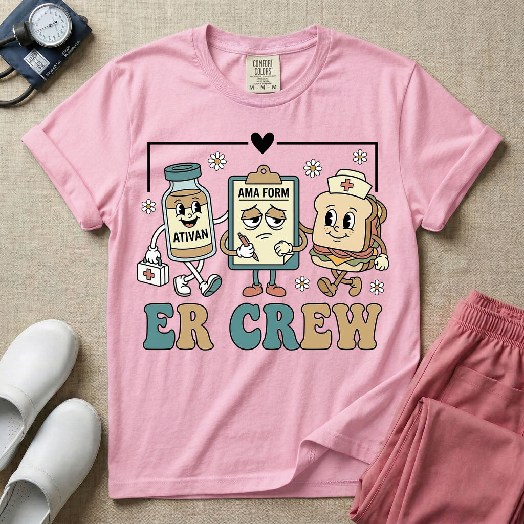 A retro-style t-shirt for emergency room nurses featuring the text "ER CREW" below a vintage cartoon illustration of a medicine bottle, a grumpy clipboard holding an AMA form, and a sandwich wearing a nurse cap walking together.