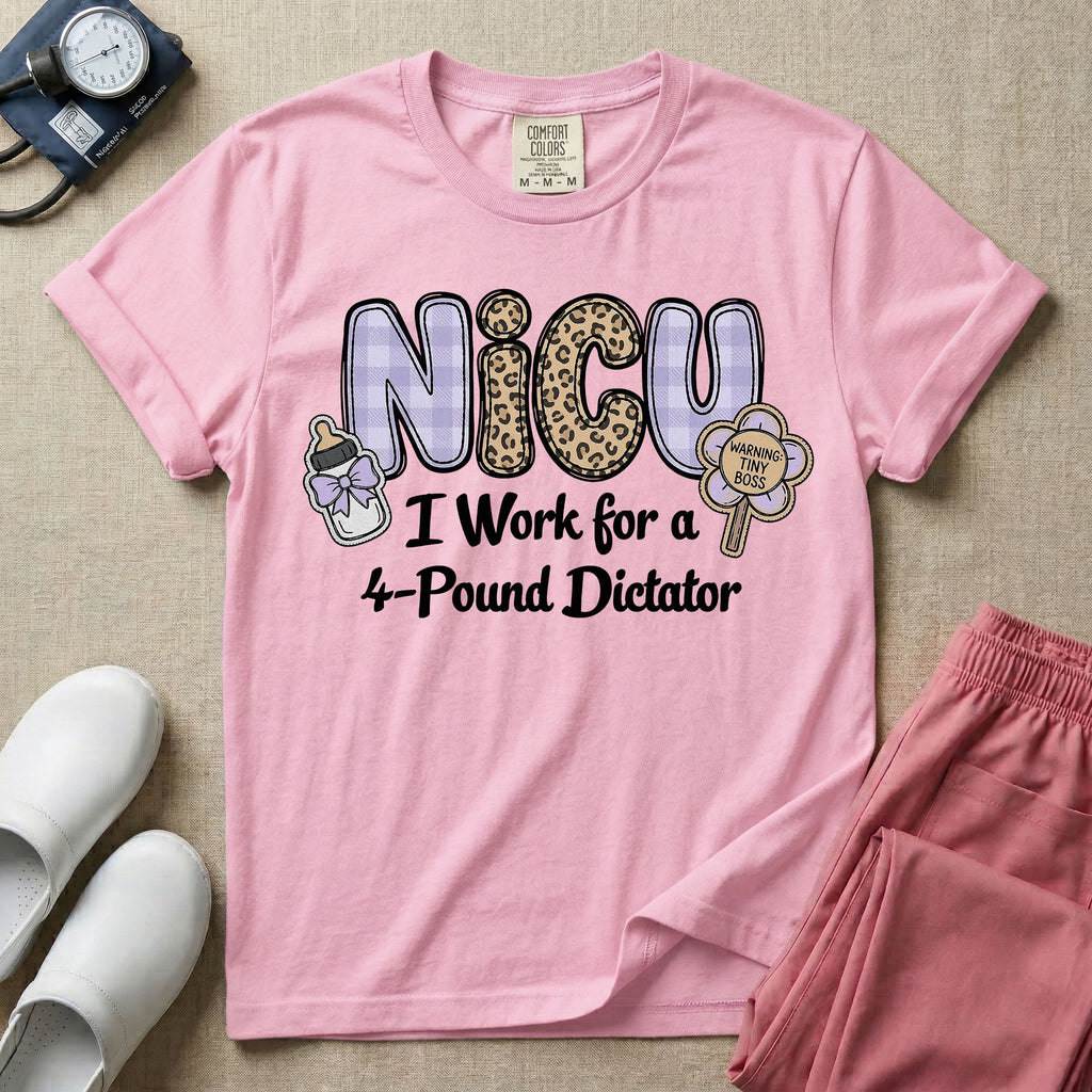 A funny t-shirt for NICU nurses featuring the text "NICU I Work for a 4-Pound Dictator" designed with purple plaid and leopard print letters, accompanied by graphics of a baby bottle with a bow and a rattle that says "WARNING: TINY BOSS".