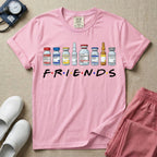 A humorous retro-style t-shirt for nurses featuring a row of seven different medical vials and medicine ampules lined up above the word "FRIENDS", which is styled with colored dots between the letters to resemble the classic television show logo.