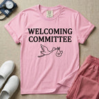 Labor and Delivery nurse graphic featuring a simple white outline of a flying stork carrying a baby bundle with a heart, placed below the text WELCOMING COMMITTEE.