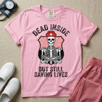 General nursing nurse t-shirt with a funny skeleton dead inside but still saving lives graphic in blossom color.
