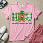 A graphic for a Neonatal Intensive Care Unit featuring the word 'NICU' in green and white plaid patterned letters, with a cute brown teddy bear wearing a leprechaun hat and holding a shamrock sitting in the middle, and the cursive text 'neonatal intensive care unit' underneath.