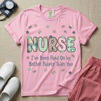 A humorous t-shirt for nurses featuring the word "NURSE" in colorful boho patterned letters above the funny phrase "I've Been Peed On by Better People Than You", surrounded by small abstract floral shapes.