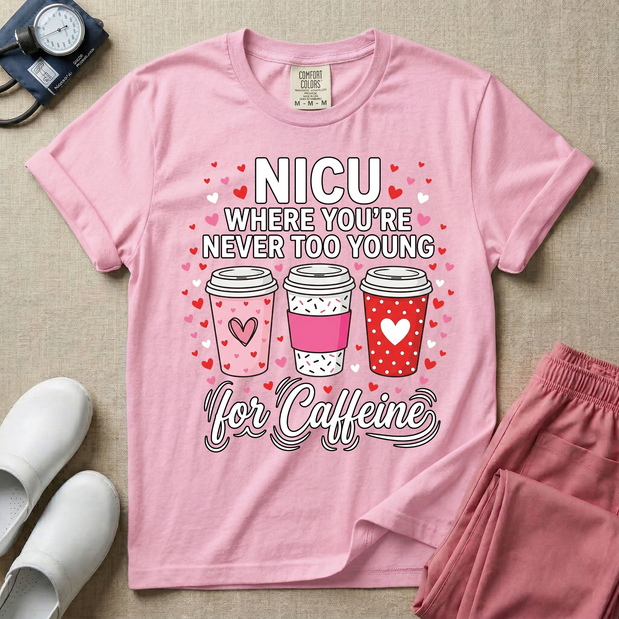 A Valentine's Day themed graphic for a Neonatal Intensive Care Unit featuring the text 'NICU WHERE YOU'RE NEVER TOO YOUNG' stacked above three to-go coffee cups decorated with heart patterns, with 'for Caffeine' written in script at the bottom, all surrounded by small red and pink hearts.