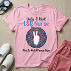 A humorous Labor and Delivery nurse graphic featuring a hand holding up two fingers inside a colorful boho mandala pattern, surrounded by text that reads Only A Real L&D Nurse Knows above and This Is Not A Peace Sign below.
