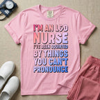 A humorous graphic tee for labor and delivery nurses featuring bold, gradient block lettering that reads "I'M AN L&D NURSE I'VE BEEN SQUIRTED BY THINGS YOU CAN'T PRONOUNCE".