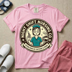 General nursing night shift nurse t-shirt with a retro vintage exhausted nurse holding coffee and a syringe established by caffeine and chaos graphic in blossom color.
