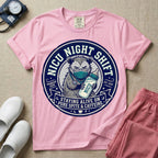 A humorous graphic for a Neonatal Intensive Care Unit featuring a circular design with an illustration of a tired raccoon wearing a medical face mask and holding a baby bottle labeled 'NICU', surrounded by the text 'NICU NIGHT SHIFT' at the top and 'STAYING ALIVE ON PURE SPITE & CAFFEINE' at the bottom.