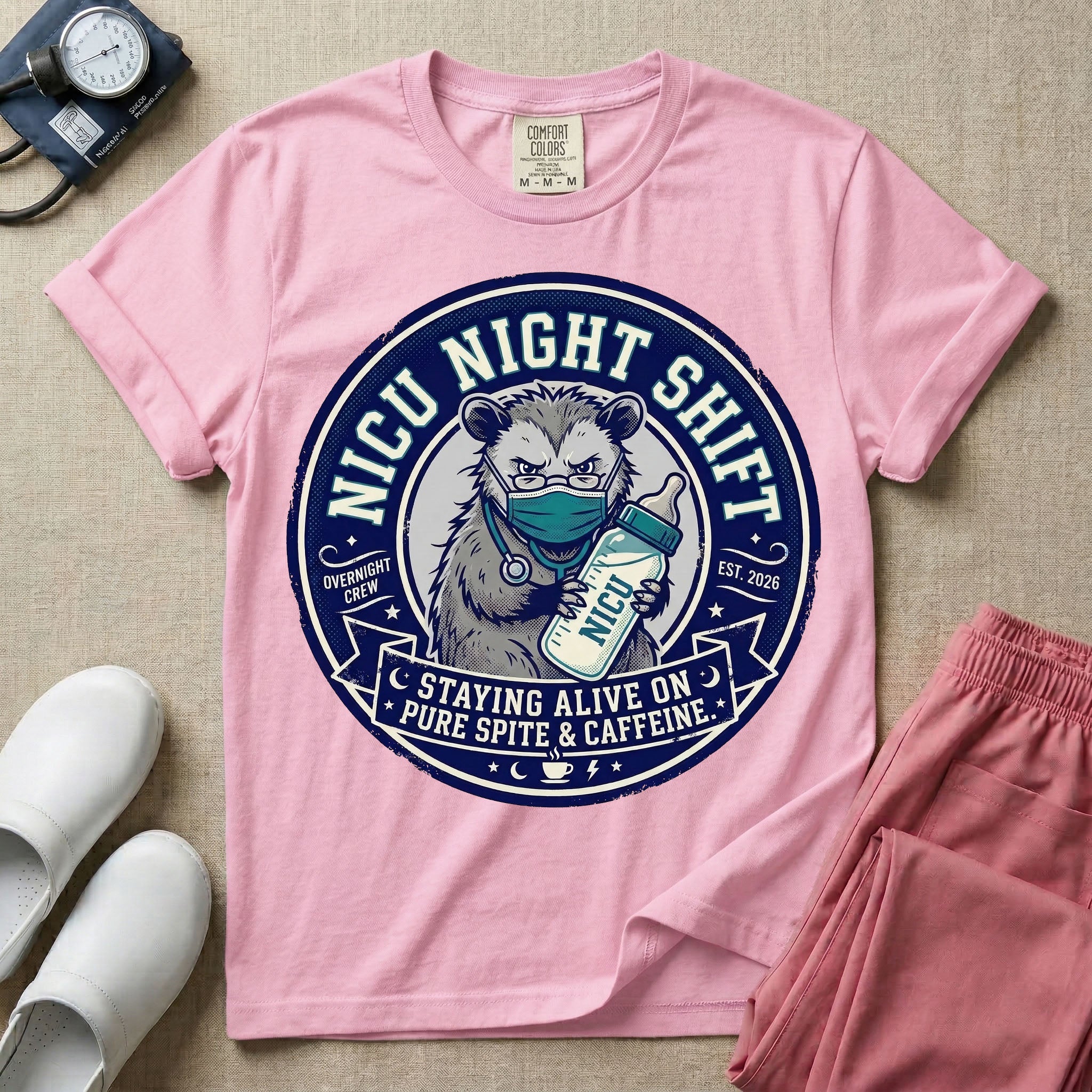 A humorous graphic for a Neonatal Intensive Care Unit featuring a circular design with an illustration of a tired raccoon wearing a medical face mask and holding a baby bottle labeled 'NICU', surrounded by the text 'NICU NIGHT SHIFT' at the top and 'STAYING ALIVE ON PURE SPITE & CAFFEINE' at the bottom.