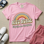 Neonatal Intensive Care Unit NICU nurse t-shirt with a retro vintage rainbow and tiny humans big attitude graphic in blossom color.