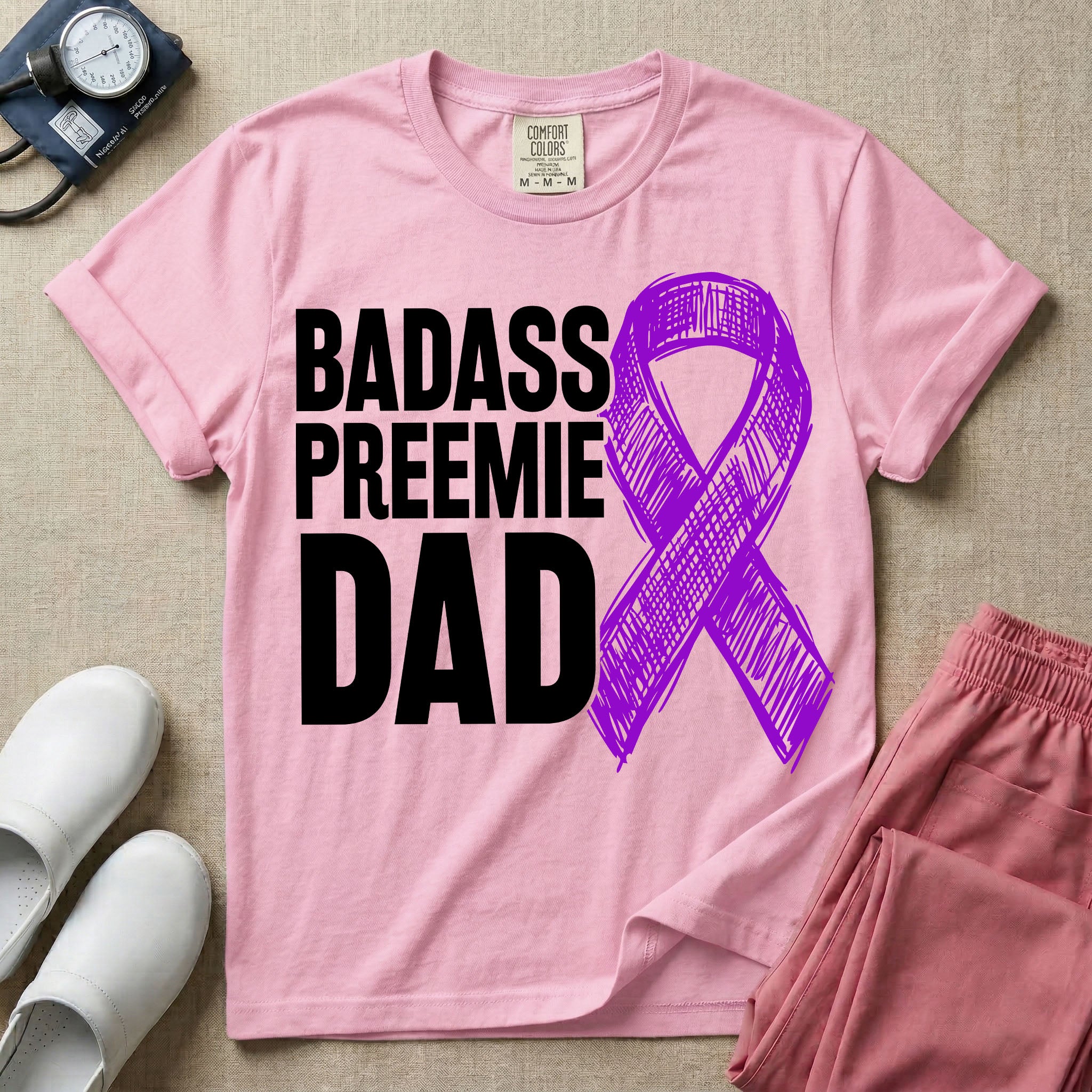 A graphic for the Neonatal Intensive Care Unit featuring the stacked, bold white text 'BADASS PREEMIE DAD' next to a large, textured purple awareness ribbon.