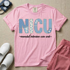 A t-shirt for NICU nurses featuring the large text "NICU" designed to look like faux embroidery with floral and plaid patterns, and the words "neonatal intensive care unit" written in a delicate script font underneath.
