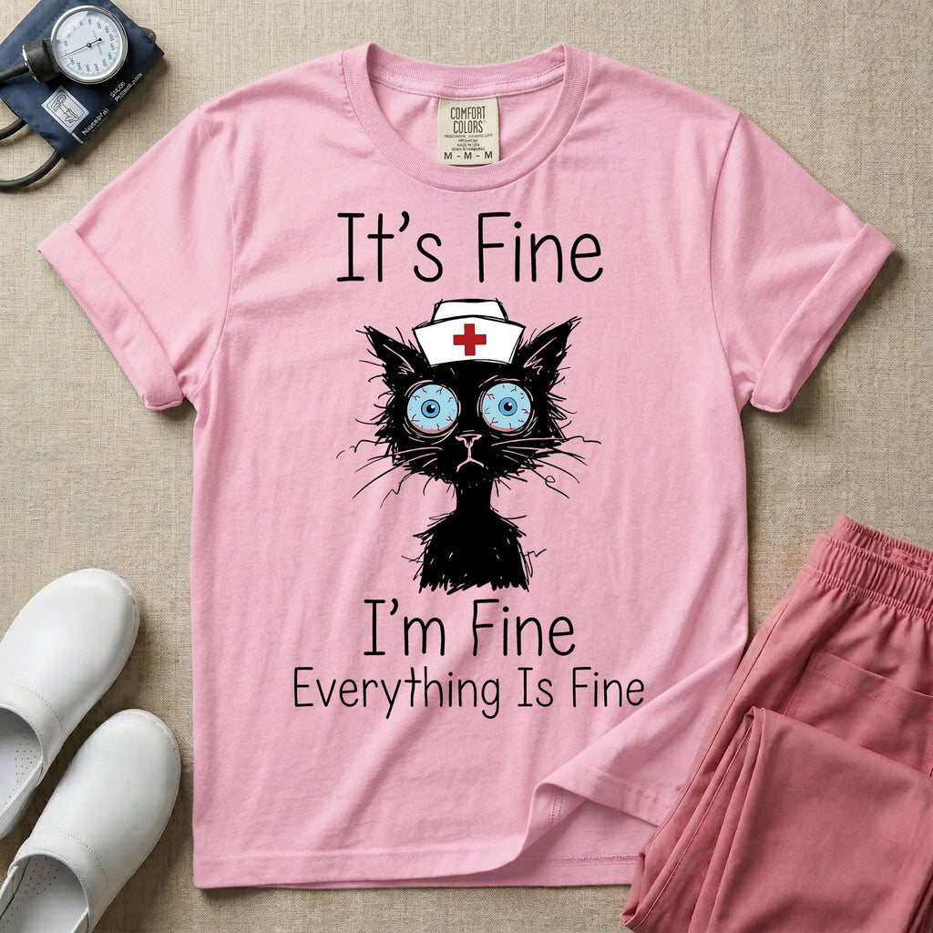 General nursing t-shirt featuring a humorous graphic of a frazzled black cat wearing a medical cross nurse cap alongside the text "It's Fine I'm Fine Everything Is Fine".