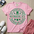 A circular green graphic featuring a leprechaun hat, shamrocks, and the text ST. PATRICK'S DAY SHENANIGANS SQUAD surrounding a center banner that reads NEONATAL ICU.