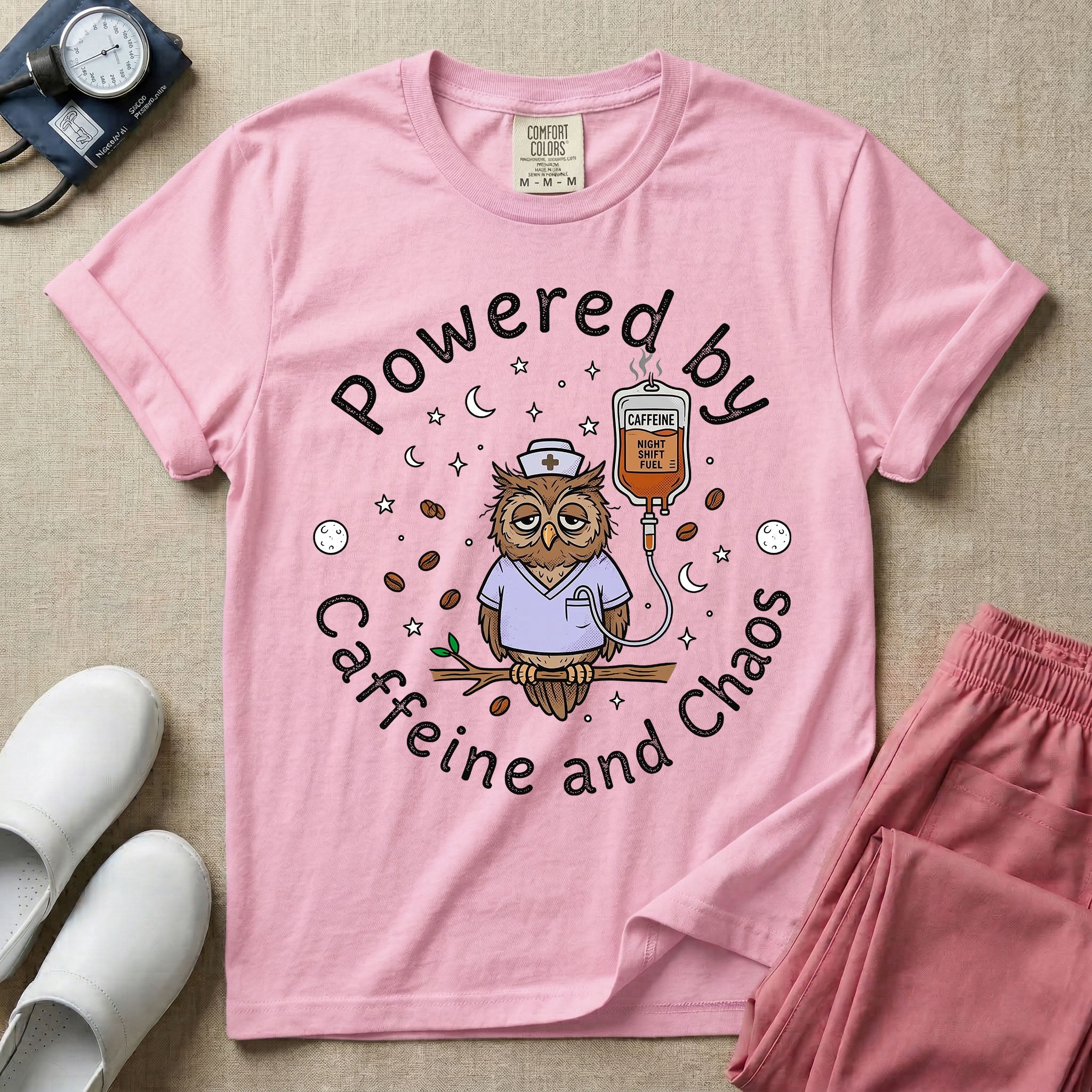 A humorous General Nursing graphic featuring an exhausted owl wearing scrubs and a nurse hat, hooked up to an IV bag labeled CAFFEINE NIGHT SHIFT FUEL, surrounded by coffee beans, stars, and moons, with circular text reading Powered by Caffeine and Chaos.