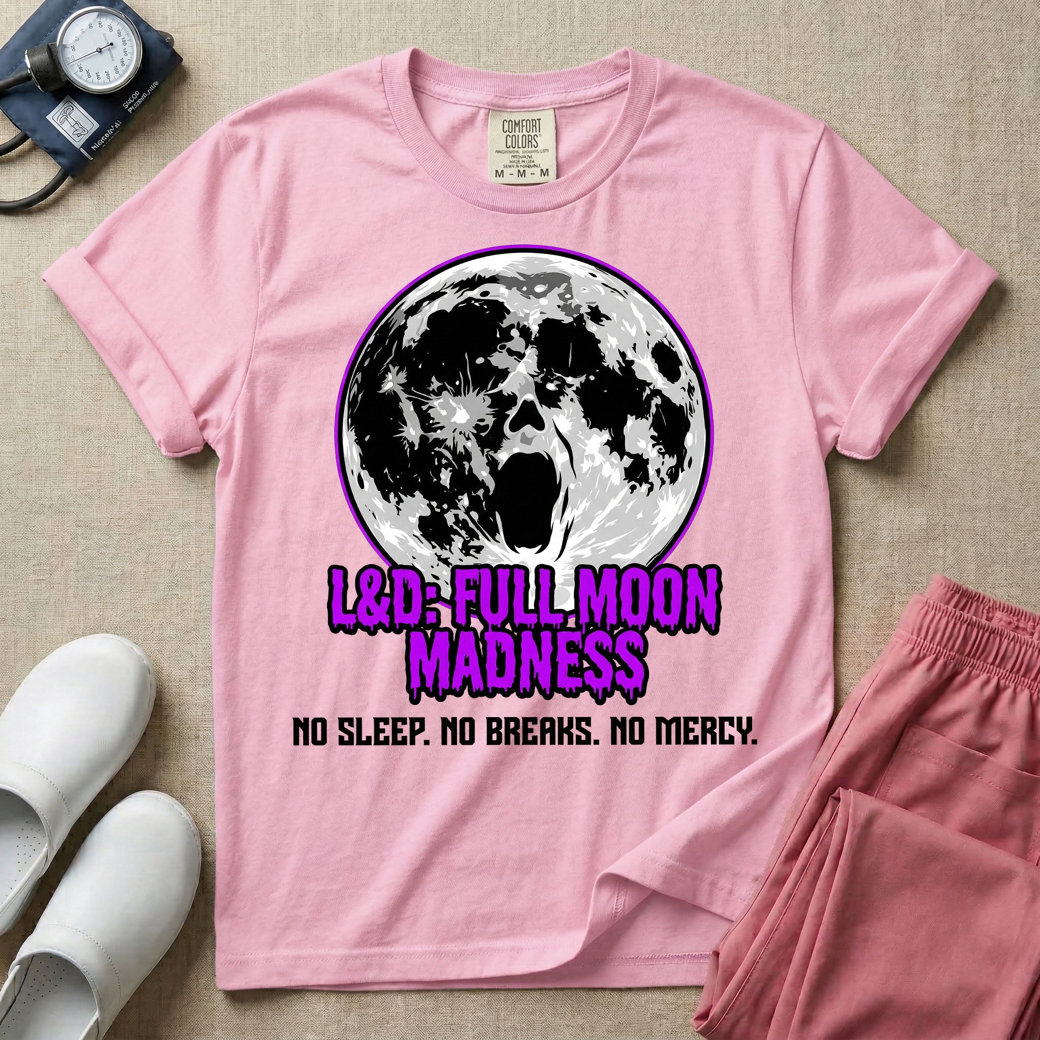A humorous Labor and Delivery nurse graphic featuring a screaming face morphing out of a full moon, accompanied by purple dripping text that reads L&D: FULL MOON MADNESS and distressed black text below reading NO SLEEP. NO BREAKS. NO MERCY.