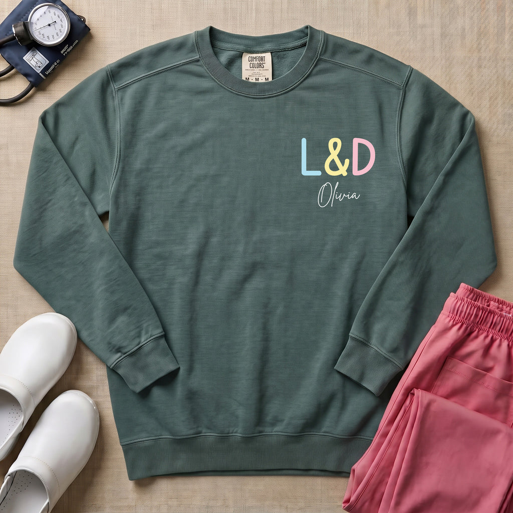 Funny Womb Service We Deliver Stork L&D Two-Sided Personalized Sweatshirt - Blue Spruce Comfort Colors Sweatshirt | HugTee