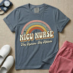 Neonatal Intensive Care Unit NICU nurse t-shirt with a retro vintage rainbow and tiny humans big attitude graphic in blue jean color.