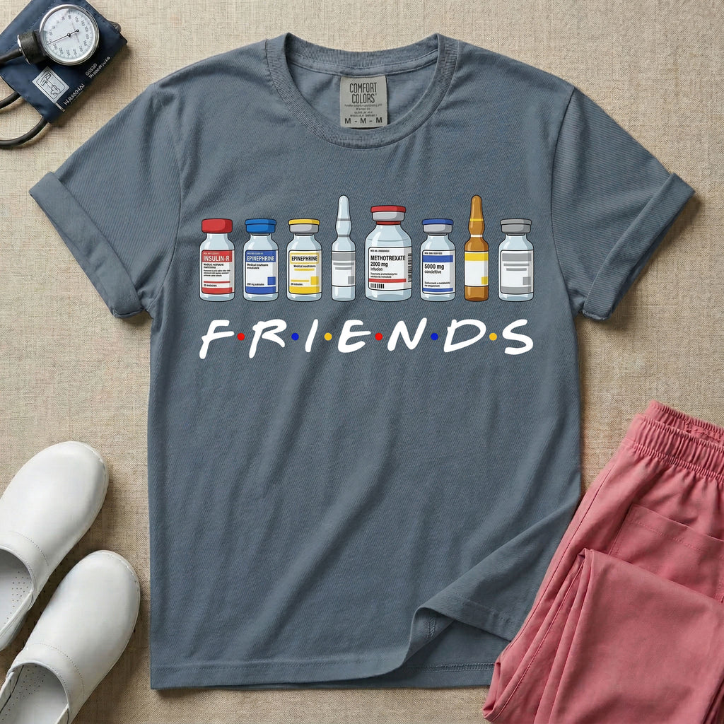 A humorous retro-style t-shirt for nurses featuring a row of seven different medical vials and medicine ampules lined up above the word "FRIENDS", which is styled with colored dots between the letters to resemble the classic television show logo.